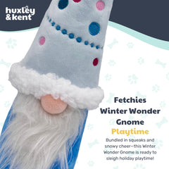 Huxley & Kent Winter Wonder Gnome dog fetching with plush toy