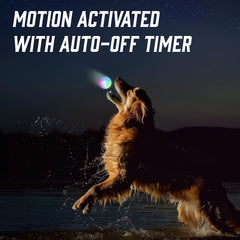 Iron Paws colour-changing LED ball glowing at dusk for engaging play