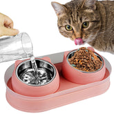 KEVIDEAWL elevated cat bowls on pink stand with stainless steel bowls reduce neck strain at mealtime.