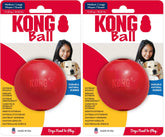 KONG Ball with Hole red fetch toy in grass for training and play.