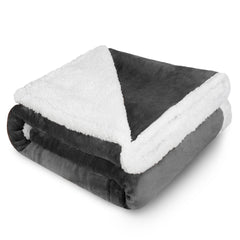 Kritter Planet dog blanket grey folded on sofa for cozy couch comfort