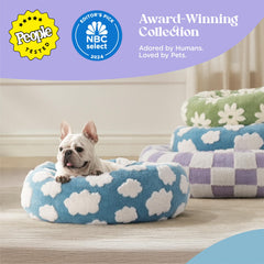 LE SURE donut bed blue side view showing raised edges for head support