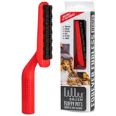 Lilly Brush Forever Furless on a sofa removes pet hair quickly for clean furniture.