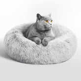 Love's cabin calming cat bed in indoor setting offers a secure cozy retreat.