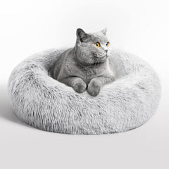 Love's cabin calming cat bed in indoor setting offers a secure cozy retreat.