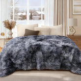 Luciphia tie-dye grey dog blanket on sofa provides cozy comfort and couch protection.