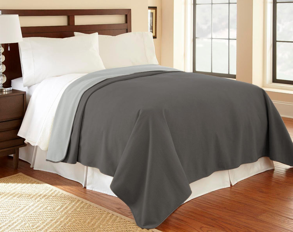 Mambe waterproof furniture cover blanket on a sofa protects from spills and pet accidents.