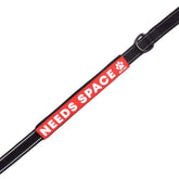 Max and Neo leash sleeve front view shows Needs Space sign for clear safety cue