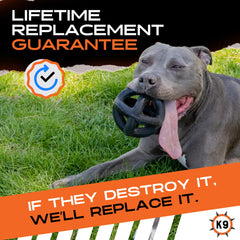 Monster K9 Indestructible Ball closeup on rubber reveals a durable core.