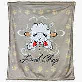 Multipet Lamb Chop Blanket rolled up for storage, showcasing soft fleece warmth for pets.