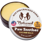 Natural Dog Company Paw Soother 4oz tin close-up shows creamy balm for dry paws.