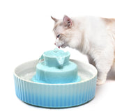 NautyPaws ceramic cat water fountain top view in sky blue for clean hydration.