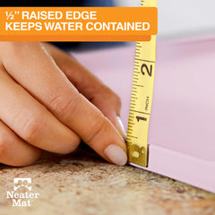 Neater Mat raised-edge closeup highlighting spill containment.