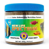 New Life Spectrum Regular 300g pellets sinking in aquarium for bottom-dwelling tropical fish.