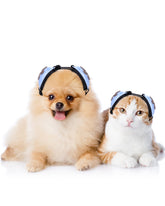 Ninuo Calming Earmuffs worn on a cat in blue for soothing sessions.