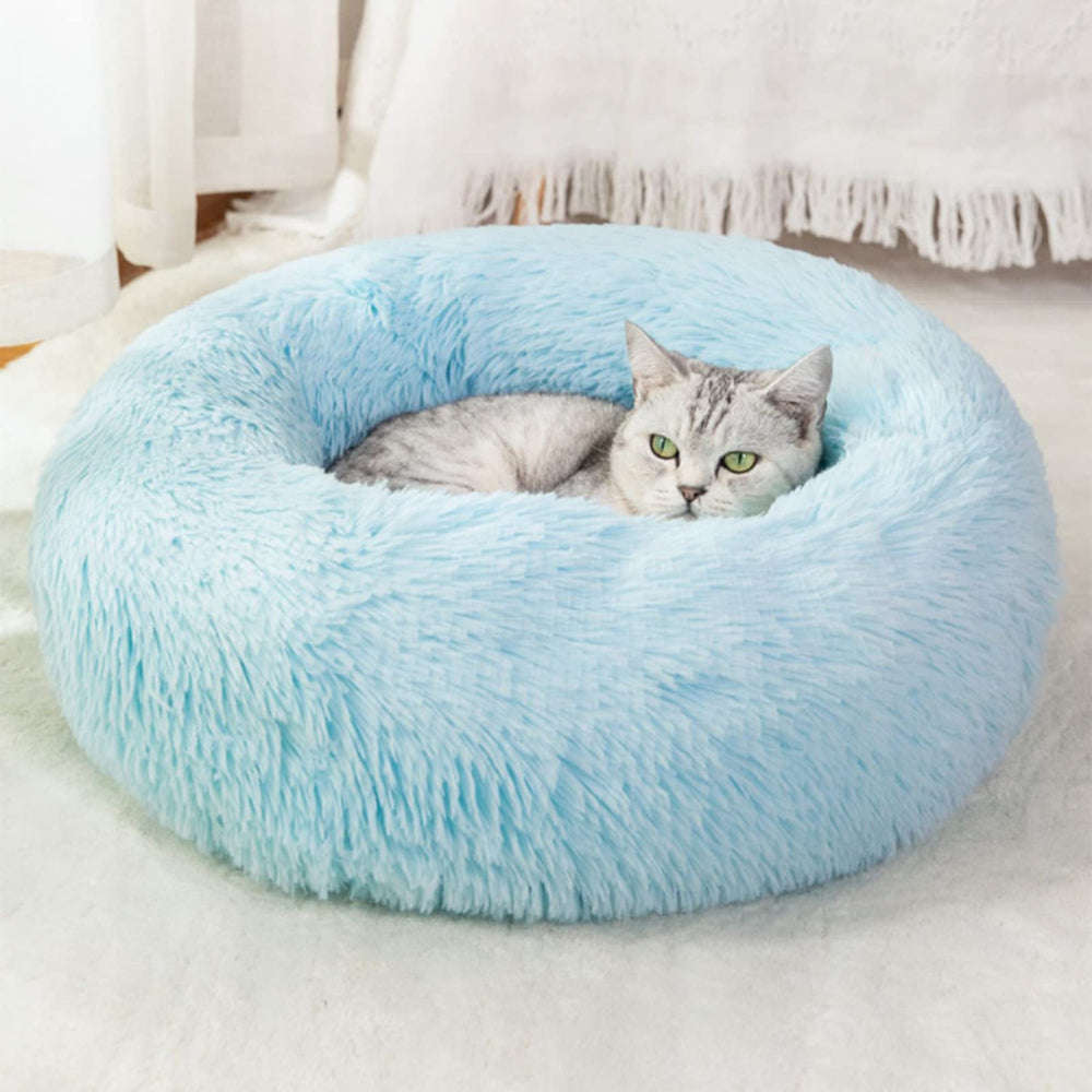 Nisrada round pet bed with donut design for secure, cozy resting.