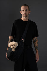 Noah & Paw dog sling carrier side view shows adjustable strap for custom fit.