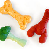 Nylabone Power Chew Toy Bundle lickable cheese bone for flavorful chewing sessions.