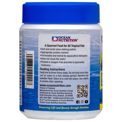 Ocean Nutrition fish food flakes alternative shown as soft pellets supporting clear water.