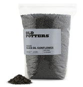 Old Potters Wildlife black oil sunflower seeds in a feeder attract diverse backyard birds