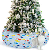 Ownpets large cat tunnel bed under Christmas tree blue — protects the tree while offering a cozy nap space.