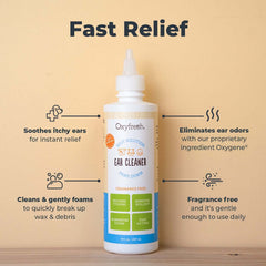Close-up of a dog's ear being treated with Oxyfresh cleaner for relief