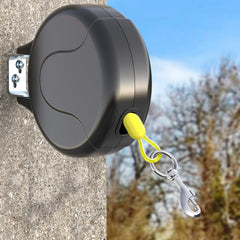 PAWSTATION 30ft wall-mount installation shows secure outdoor tie-out for safe yard access.