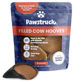 Pawstruck peanut butter filled cow hooves front closeup, tasty dental chew.