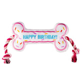 Pawty Dog Toys Birthday Bone Toy pink front view for interactive fetch sessions.
