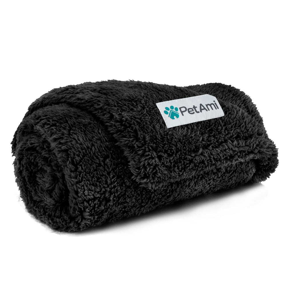 PetAmi fluffy waterproof blanket draped over a couch protects upholstery from spills.