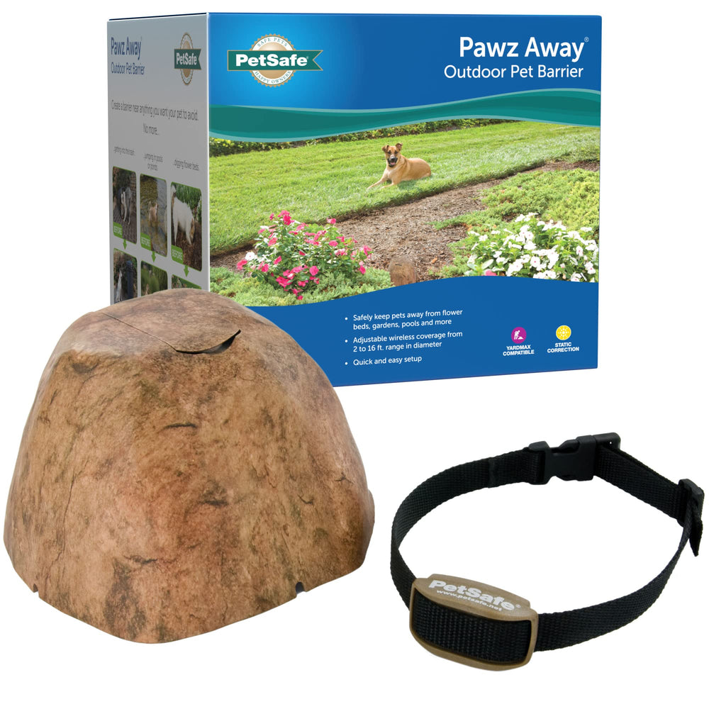 PetSafe Pawz Away outdoor barrier transmitter visible in yard, blending with landscaping for discreet containment