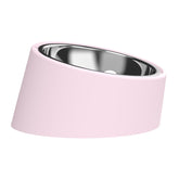 Pink Elevated Dog Bowl Set tilt demonstrates ergonomic design for easier eating.