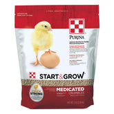 Purina Start & Grow bag with chicks showing medicated chick feed for growth support.