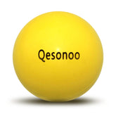 Qesonoo dog ball indestructible yellow close-up shows tough rubber for tough chewers