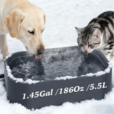 Qvamodo heated water bowl outdoors setup with warmth for pets.