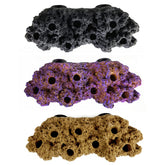 Reefing Art magnetic frag rack with floating rock secures coral fragments for neat display.