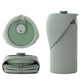 Saker portable dog water bottle in use on a hike providing on-the-go hydration.