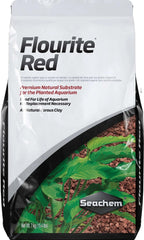 Seachem Flourite Black Clay Gravel pouring into aquarium for natural look and ease of use.