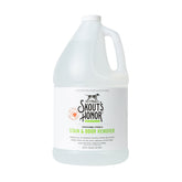 SKOUT'S HONOR Pet Stain and Odor Remover bottle pour demonstrates quick stain lift on carpets