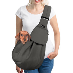 SlowTon dog carrier sling with adjustable shoulder strap for comfortable hands-free walks.