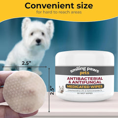Smiling Paws Pets wipes being used on a paw area for quick care
