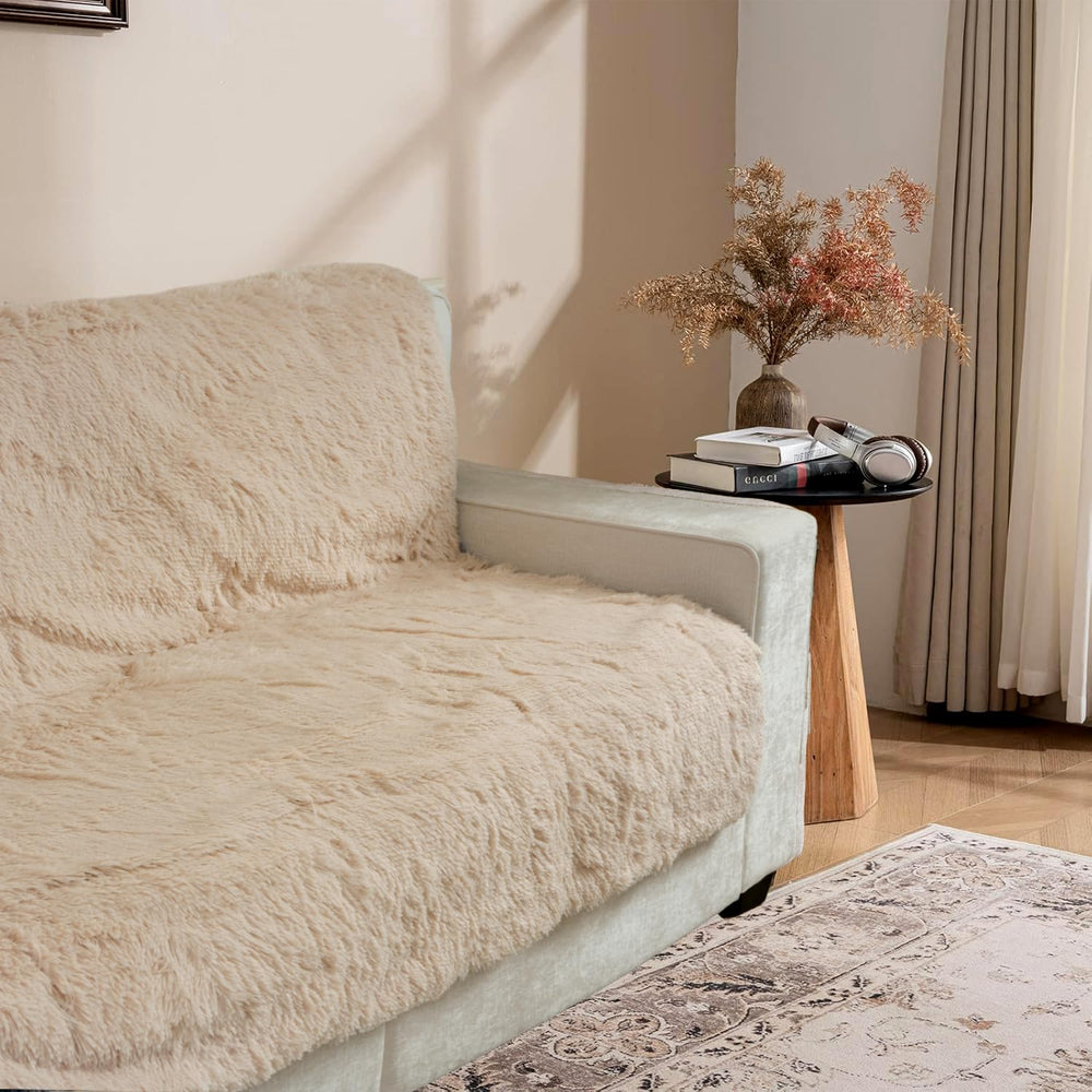 Snugglesinto beige dog pad on sofa delivers cozy pet comfort and furniture protection.
