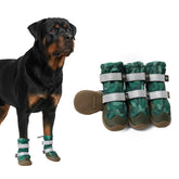 Spark Paws dog shoes green camo being worn outdoors, waterproof paw protection for all terrains.