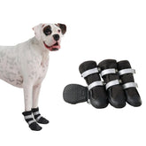 Spark Paws dog shoes pack black on rugged terrain for all-weather protection.
