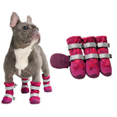 Spark Paws pink camo dog shoes with secure straps ready for outdoor adventures.