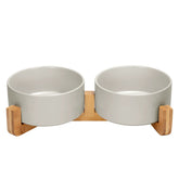 SpunkyJunky ceramic dog bowl on a wood stand improves feeding posture.