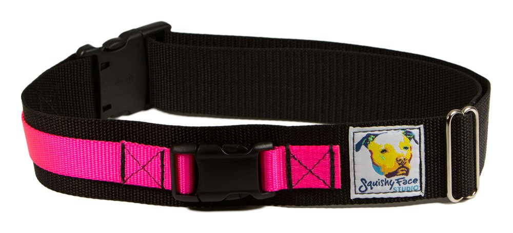 Squishy Face Studio leash belt neon pink worn on hips enables hands-free control during walks.