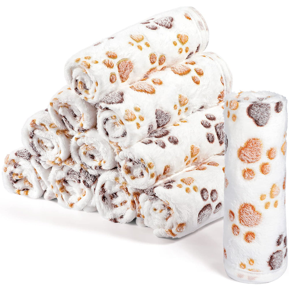 Tegeme paw-print blanket provides cozy warmth for small pets.