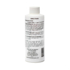 The Stuff leave-in dog conditioner spray-action demonstrates quick detangling during grooming.
