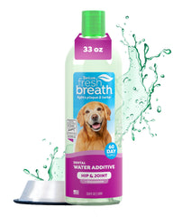 TropiClean Fresh Breath Water Additive bottle being poured into a dog's water bowl
